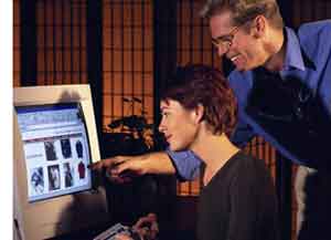 Picture of couple looking at computer